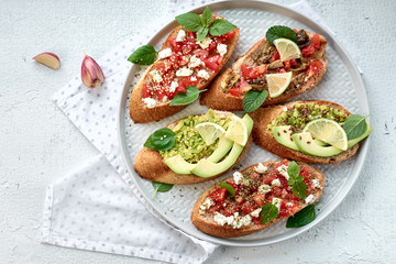 Bruschetta with vegetables and cheese.