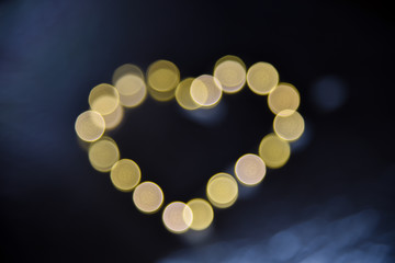 Heart Shaped Bokeh Lights Against Dark Background