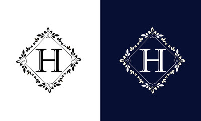 Classic floral monogram on black and white background with letter H. Design for wedding invitations, business sign.