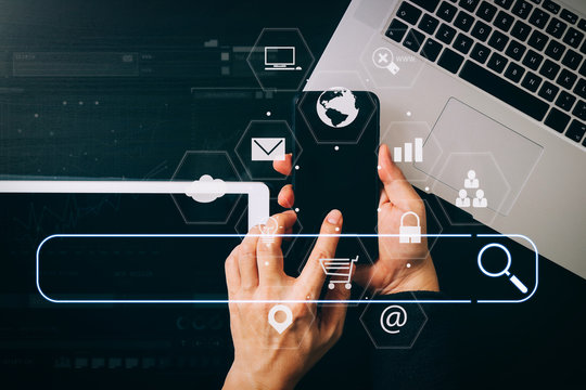 cyber security internet and networking concept.Businessman hand working with VR screen padlock icon mobile phone on computer background