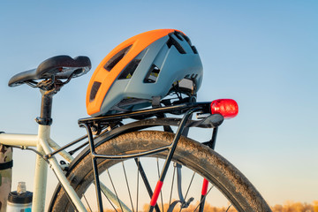 biking helmet on racks of a touring bike © MarekPhotoDesign.com
