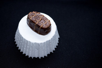 Various of sweet confectionery with chocolate candies and pralines. Handmade chocolates. Realistic chocolate set, delicious dessert pattern.