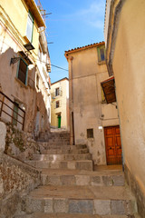 Fototapeta na wymiar Castelcivita, Italy. A narrow street between the old houses of a medieval village