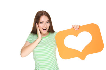 Young woman holding paper card with heart on white background