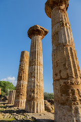 Ruined Temple of Heracles columns in famous ancient Valley of Temples in Agrigento, Sicily, Italy.