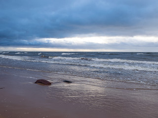 beautiful seascape, dark clouds and white waves
