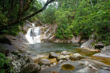 Josephine Falls and Fast Flowing Stream in rainforest at Wooroonooran National Park near Cairns, Queensland Australia.