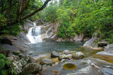 Josephine Falls and Fast Flowing Stream in rainforest at Wooroonooran National Park near Cairns,...