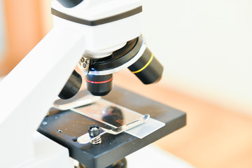 Microscope close-up. shot of microscope with metal lens with abstract with points, lines, and shapes