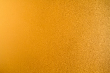 Naklejka premium Ochre colored paper sheet detail