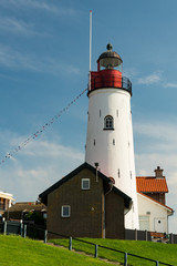 Fototapeta na wymiar Lighthouse of Urk, against blue sky. The Netherlands.