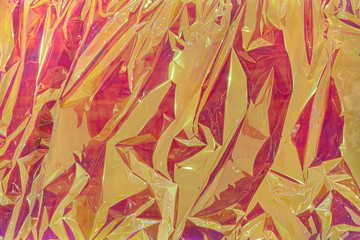 Modern conceptual crumpled cellophane film background. Strong wrinkled colorful texture