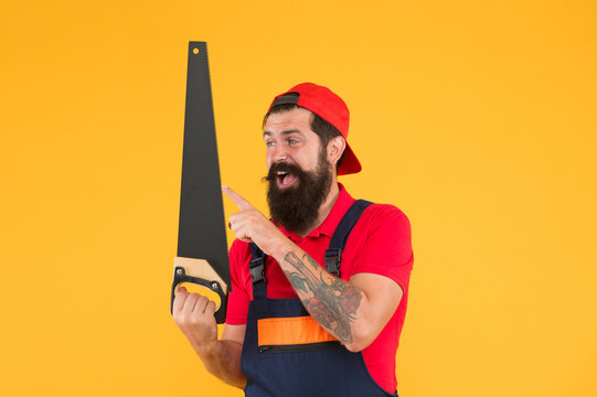 Man hold handsaw in hand. Carpentry works. Repair wooden objects. Carpentry service. Carpentry workshop concept. Professional tools. Builder worker carpenter handyman hold saw. Safety measures - Powered by Adobe