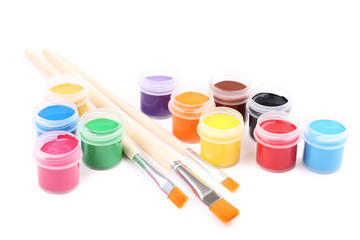 Colorful gouache paints and brushes isolated on white background