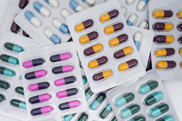 Colorful of tablets and capsules pill in blister packaging. Pharmaceutical industry concept. 