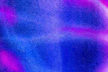 Beautiful bright colorful street art graffiti background. Abstract creative spray drawing fashion colors on the walls of the city. Urban Culture, black ,blue, purple , violet , neon texture