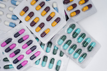 Colorful of tablets and capsules pill in blister packaging. Pharmaceutical industry concept. 