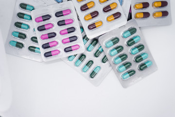 Colorful of tablets and capsules pill in blister packaging. Pharmaceutical industry concept. 