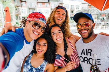 Air Force Veteran and friends having a 4th of July BBQ party at apartment complex. 