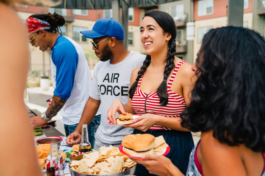 Air Force Veteran and friends having a 4th of July BBQ party at apartment complex. 