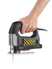 Hand holds electric jig saw isolated