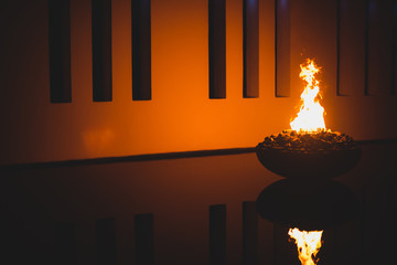 Abstract photo of a wall illuminated by fire 