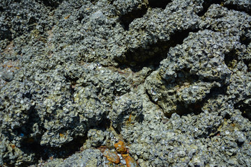 Stone courtyard on the public beach,Beautiful seascape with natural stone yard on beach against cloudy sky,Rocky shore at the seacoast with seascape and blue sky,