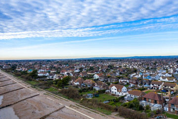 Aerial view of Felpham looking towards Bognor Regis along the beach at low tide.