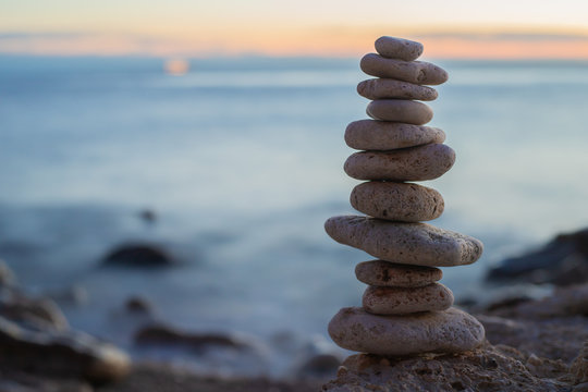 Zen concept. Sunset. The object of the stones on the beach at sunset.  Relax & Meditation. Zen stones. Blue hour