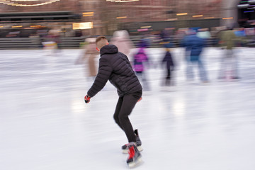 Skating on the ice rink.