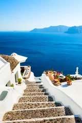 Foto op Canvas White architecture and blue sea on Santorini island, Greece. Stairs to the sea. Summer holidays, travel destinations concept © smallredgirl