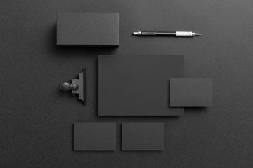 Real photo, black stationery branding mockup template, on black background to place your design.