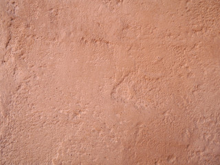Rough surface of beige, peach color, background