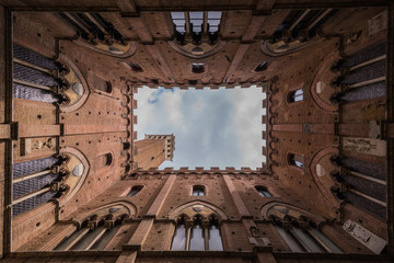geometric photo torre del mangia palazzo di città siena in italy downtown rectangular shapes windows bricks medieval history historical palace in piazza del campo italian city tuscany