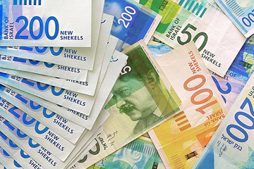 Israeli money stack of the new Israeli money bills (banknotes) of 50, 100 and 200 shekel. New Israeli Shekel series C.