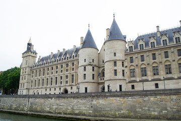 Fototapeta na wymiar Conciergerie - former royal castle and prison in the center of Paris. Conciergerie Castle is part of the Palace of Justice complex.