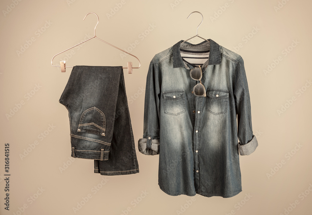 Wall mural Denim outfit - dark blue women's jeans and a shirt