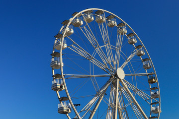 Ferris Wheel Over Blue Sky