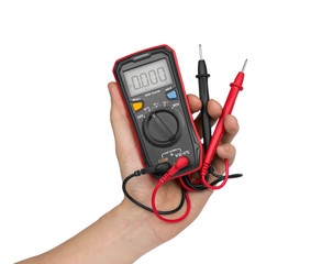 Hand with digital multimeter isolated on white background