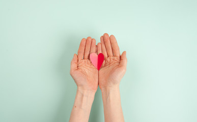 woman hands with red heart
