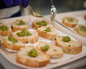 Plate of bruschettas with guacamole set on the table