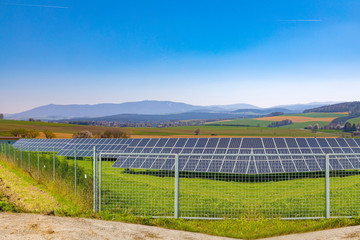 Solar panel, alternative electricity source - concept of sustainable  resour ces.Summer landscape.