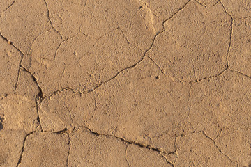 Concrete coating. Cracked stone background. Cement slab. Wall of the house.