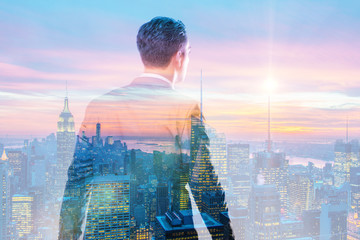 Successful businessman against cityscape in business concept