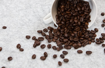 Good coffee beans in a caffe mug