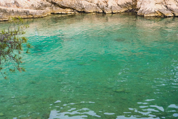 Beautiful landscape with turquoise water surface and rocky cliffs in Calanques National Park.