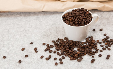 Good coffee beans in a caffe mug