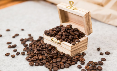 Roastedcoffe beans in a treasure chest