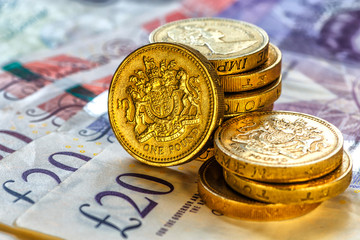 British coins stack on black, pound sterling,Business concept