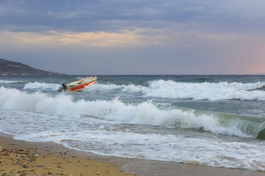 small boat at sea in a storm